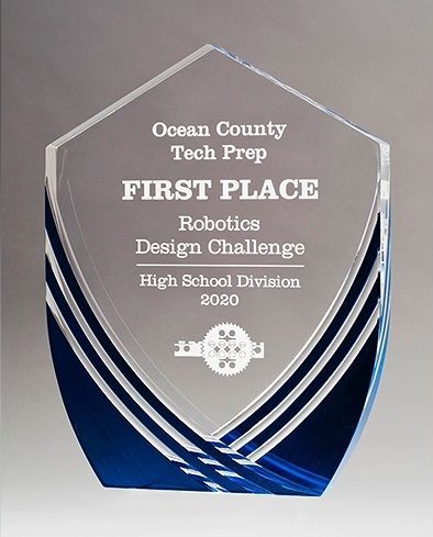 Shield shape acrylic award with brushed blue accents.