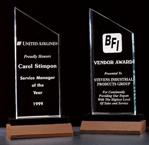 Zenith acrylic recognition award on a solid walnut base.