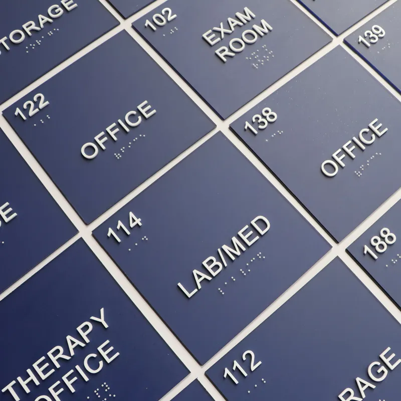 ADA braille/raised letter signs.