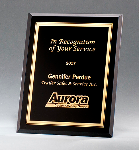 Black glass recognition plaque with gold frame.