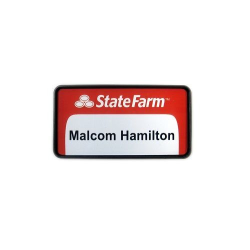 White thermal printed plastic name badge, set in black executive frame.