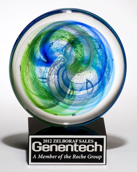 Blue and green disc shaped art glass recognition award.