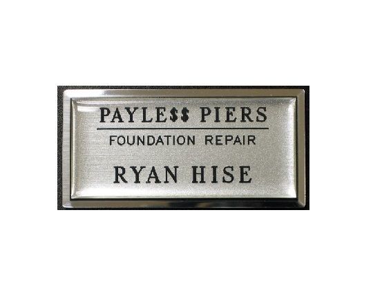Laser engraved name badge with protective dome on large silver premier frame.