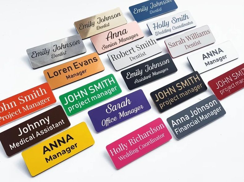 Laser engraved name badges/tags in various colors.