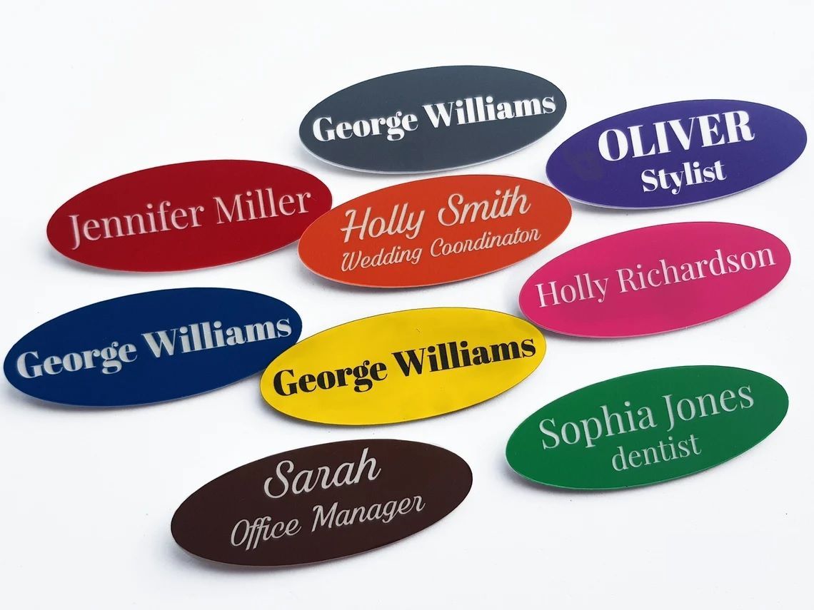 Laser engraved name badges/tags in various colors.