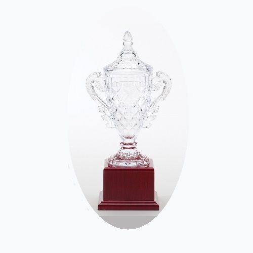 Crystal golf trophy on rosewood base.