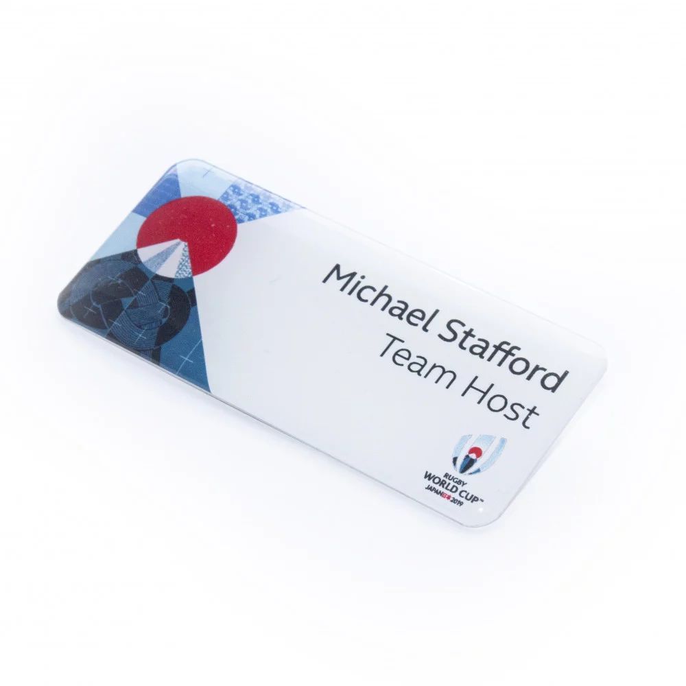 Thermal printed plastic name badge with protective dome.