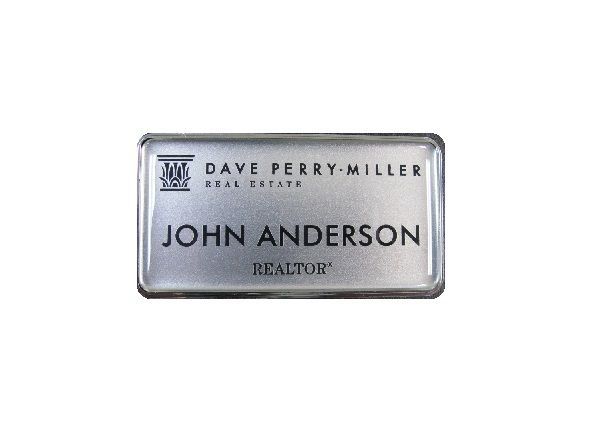 Laser engraved silver plastic realtors badge with protective doming.