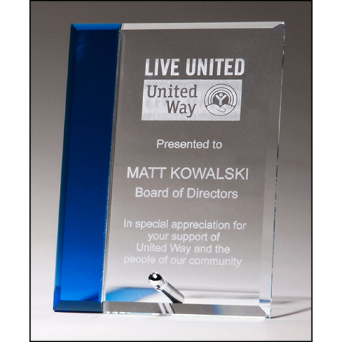 Clear glass recognition award with sapphire blue highlight.