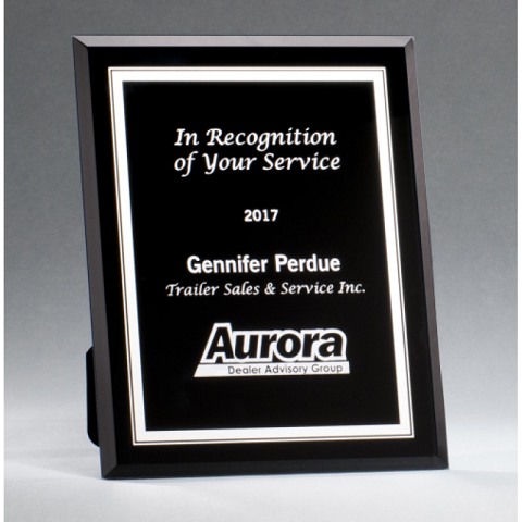 Black glass plaque with silver borders.