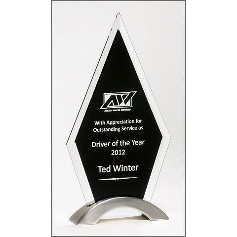 Diamond shaped glass recognition award with black background.