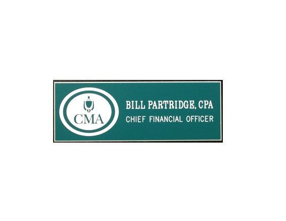 Laser engraved green name badge featuring logo, name and title.