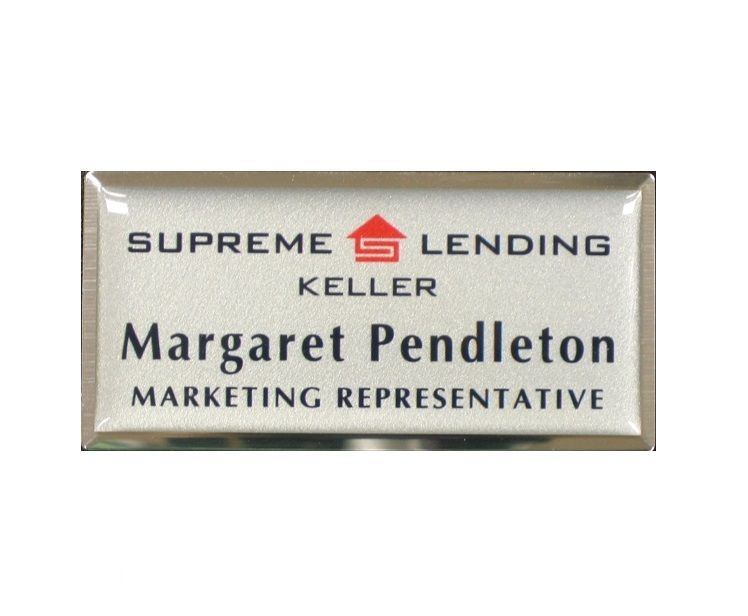 Domed thermal printed plastic name badge on silver frame.