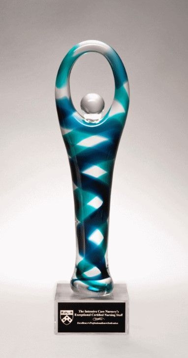 Figure shaped victory art glass award.