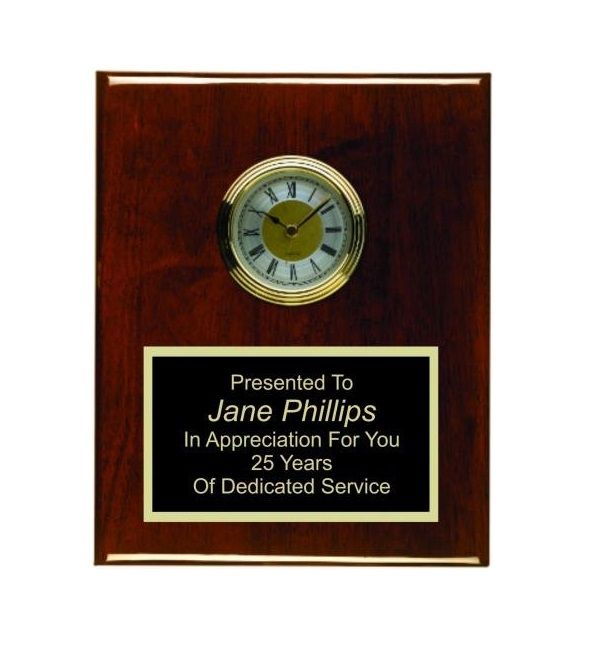 Red rosewood piano finish recognition award plaque with ornate clock and plate.