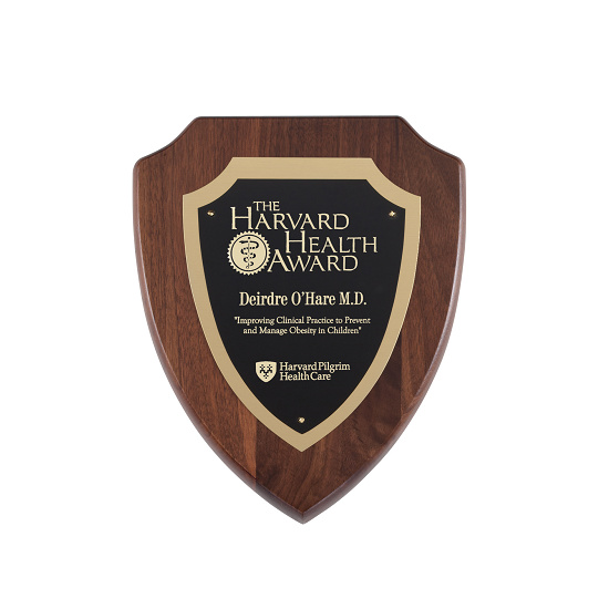 Scalloped corner shield wooden recognition plaque with ornate gold accents and backplate.