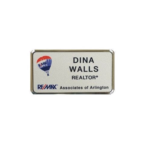 Silver thermal printed plastic name badge, set in silver executive frame.