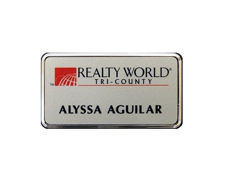 Silver thermal printed plastic name badge, set in silver executive frame.