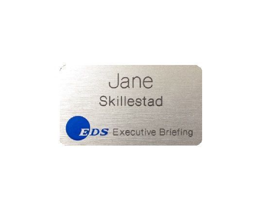 Sublimated brushed aluminum name badge with corporate logo and name.