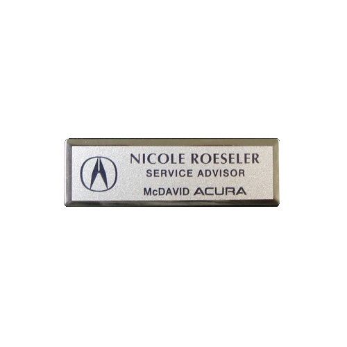 Thermal printed silver name badge on small premier silver frame.