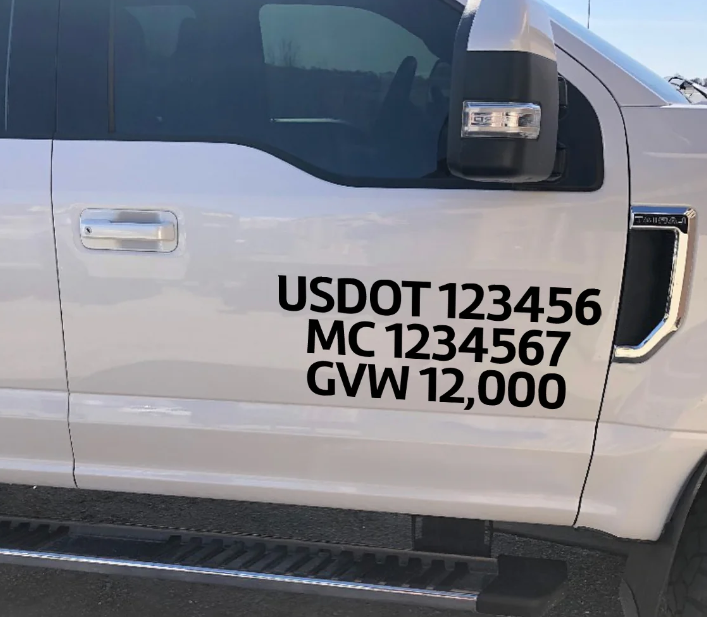 Vinyl on vehicle exterior, USDOT, state DOT, gross vehicle weight lettering.