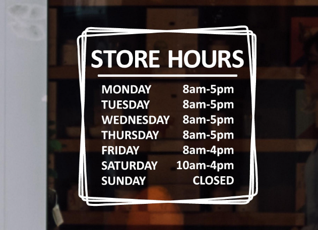 Vinyl cut exterior window store hours signage.