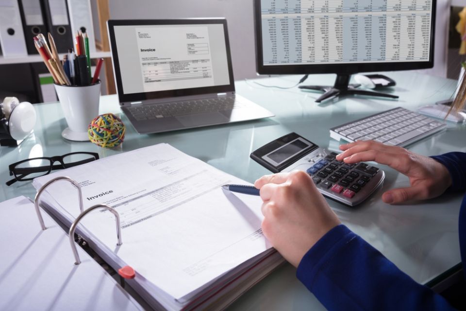 financial inspector hands making report, calculating or checking balance
