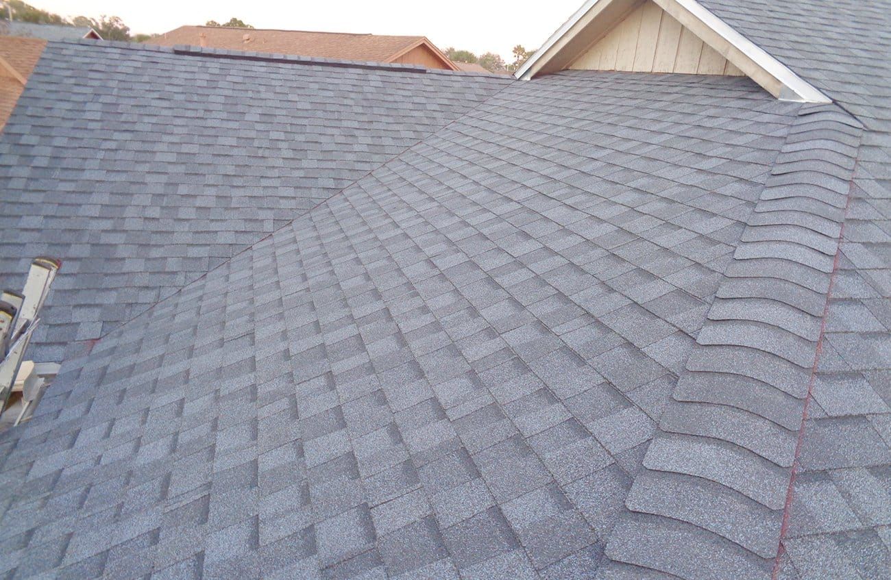 A close up of a roof with shingles on it