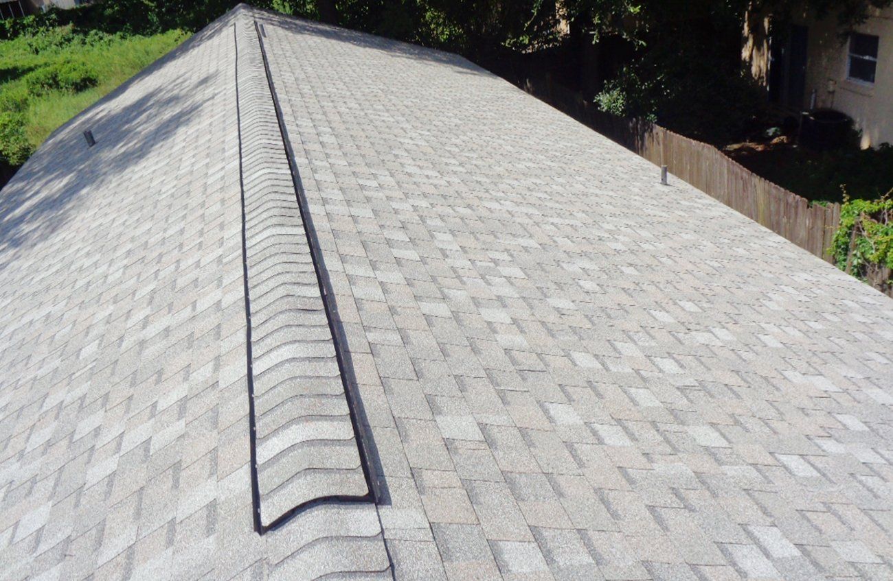 A close up of a roof with shingles on it.