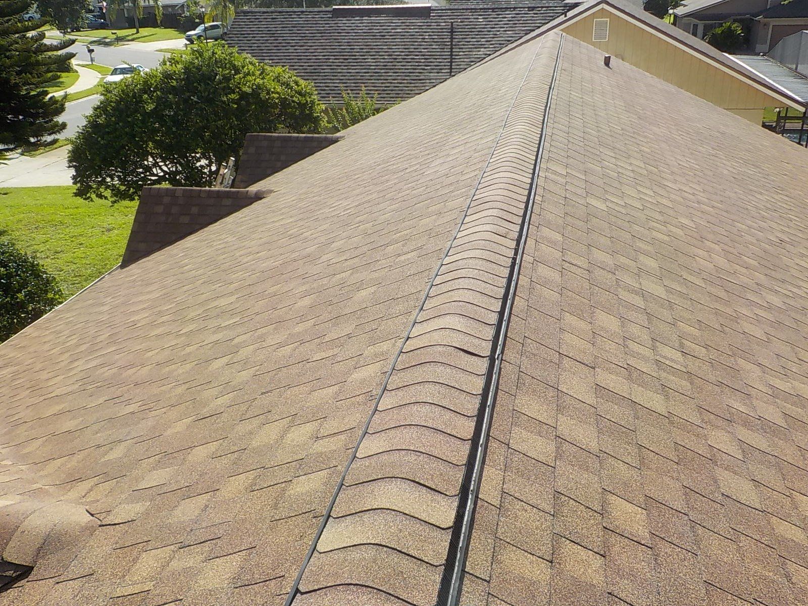 A close up of a roof with a gutter on it