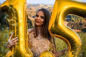 Woman holding gold 