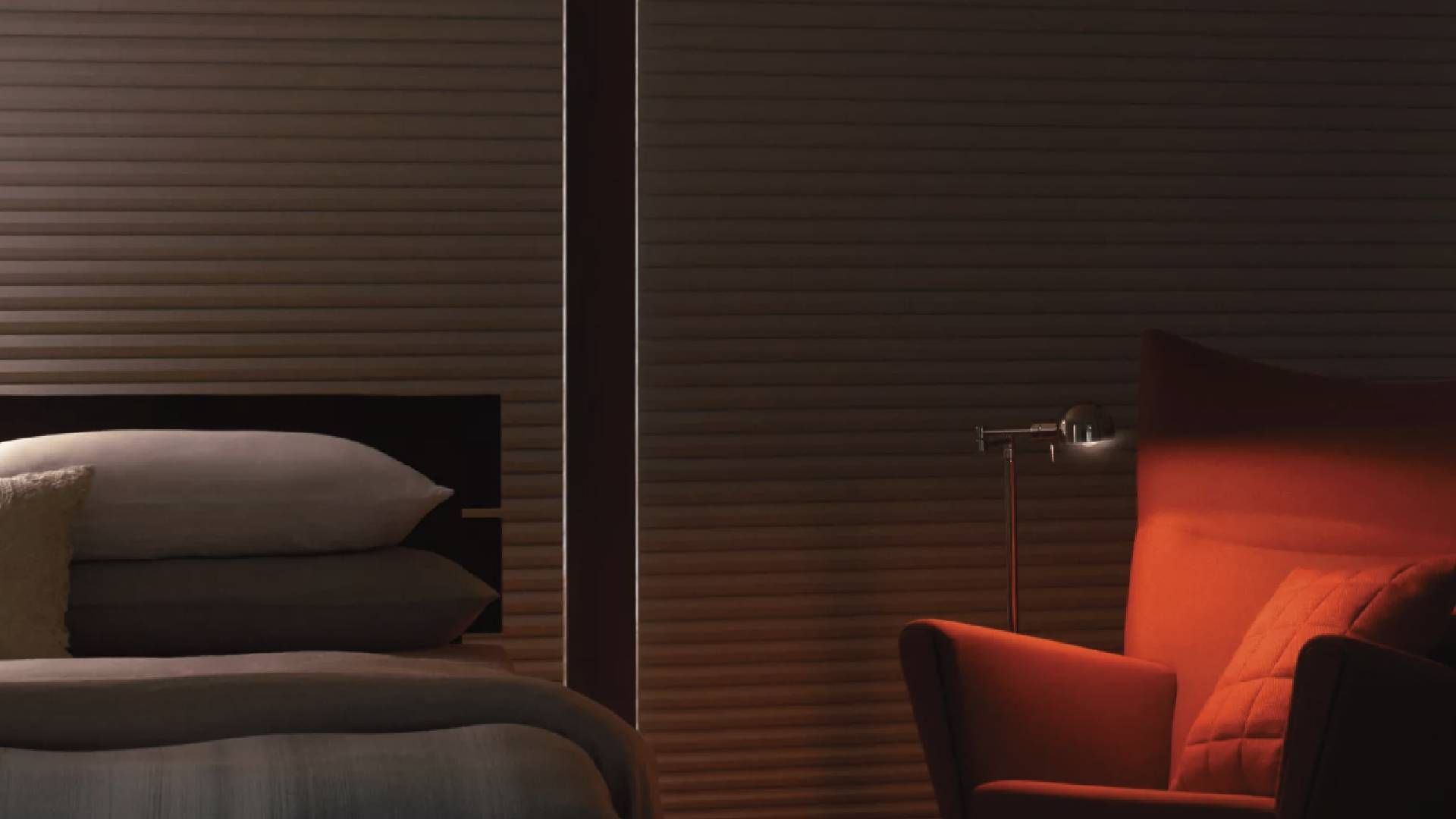 Hunter Douglas Duette® Architella® Room Darkening Shades Next to a Bed and Chair near Elkhorn, Nebra