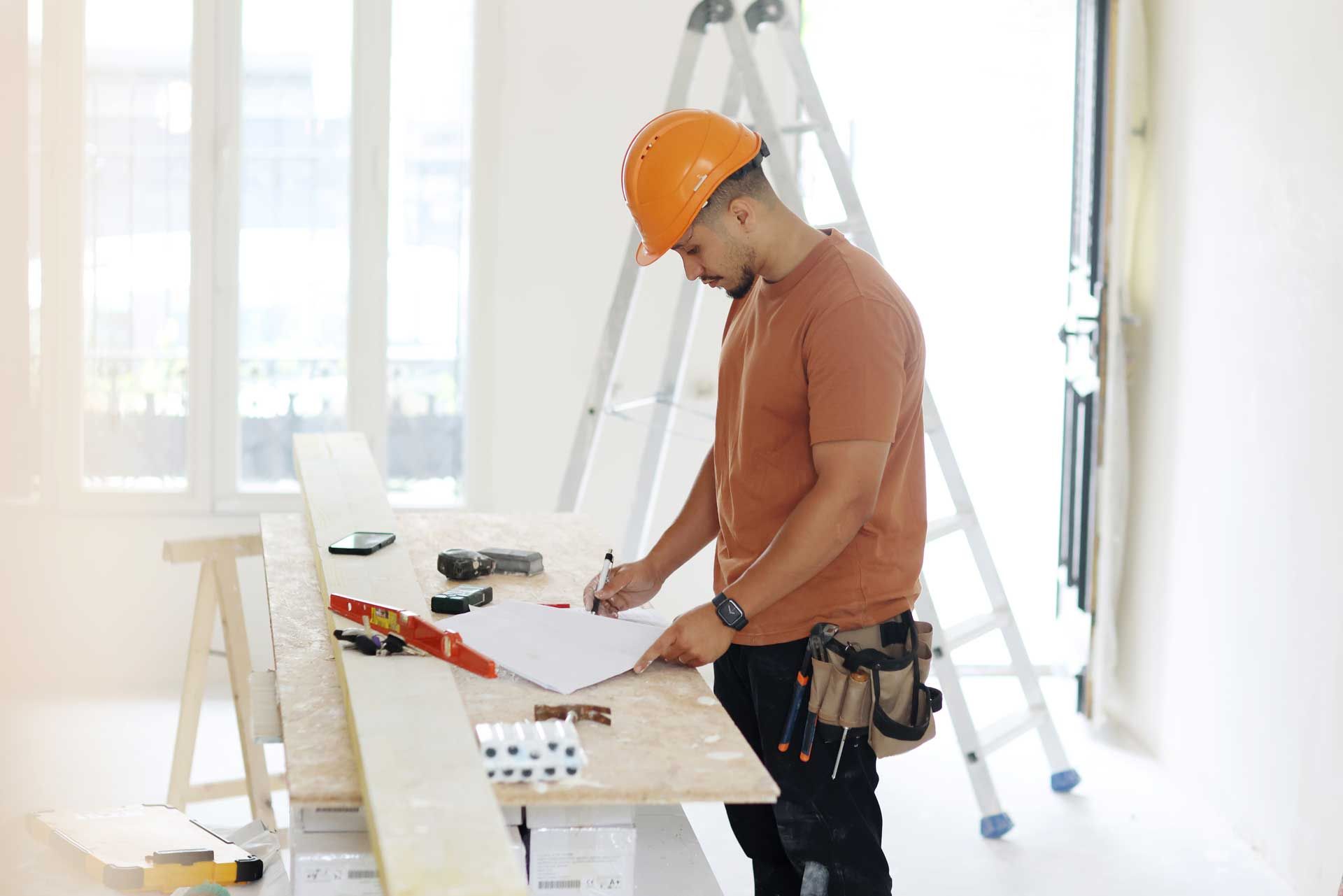 A man is watching the plans of a home renovation. A man is watching the plans of a home renovation.