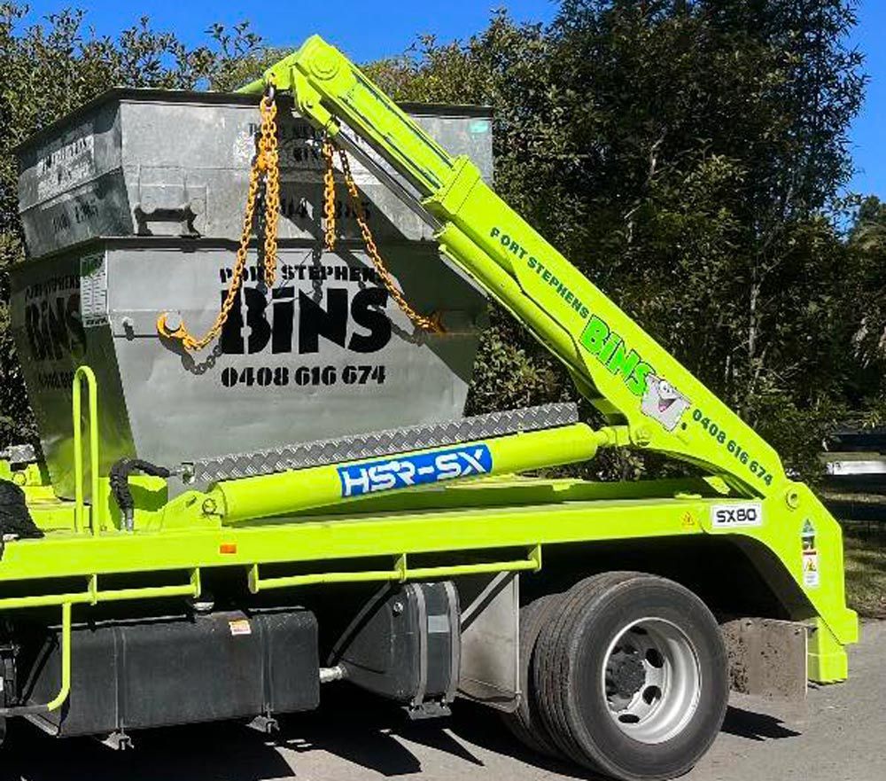 Truck With Skip Bins On The Back