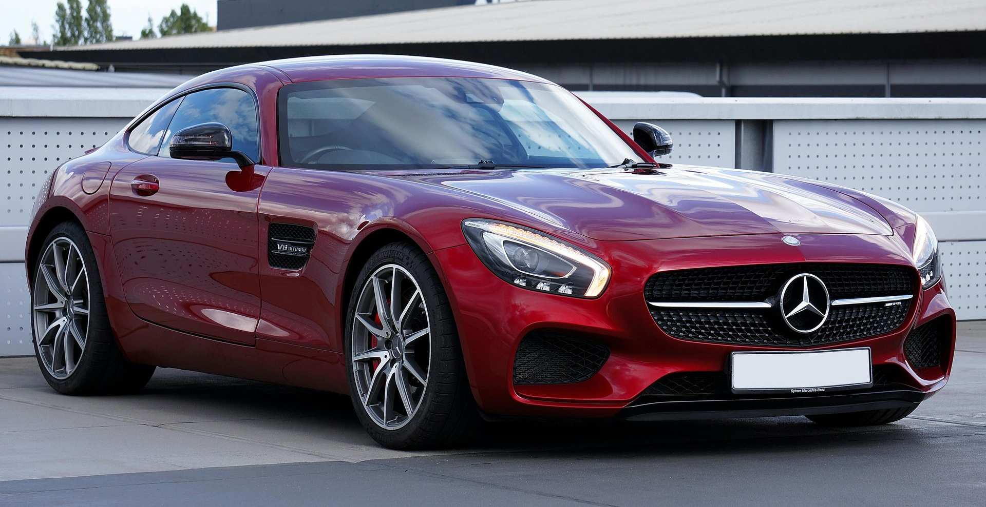 Car under strong sunlight showing need for windshield tint