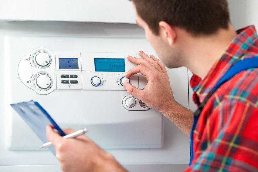 Man fixing a boiler