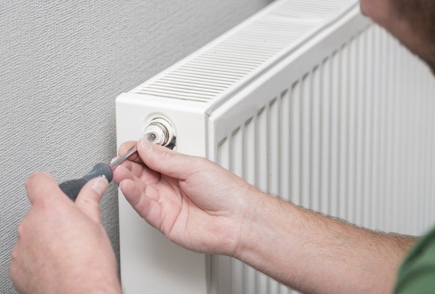 Engineer fixing a boiler