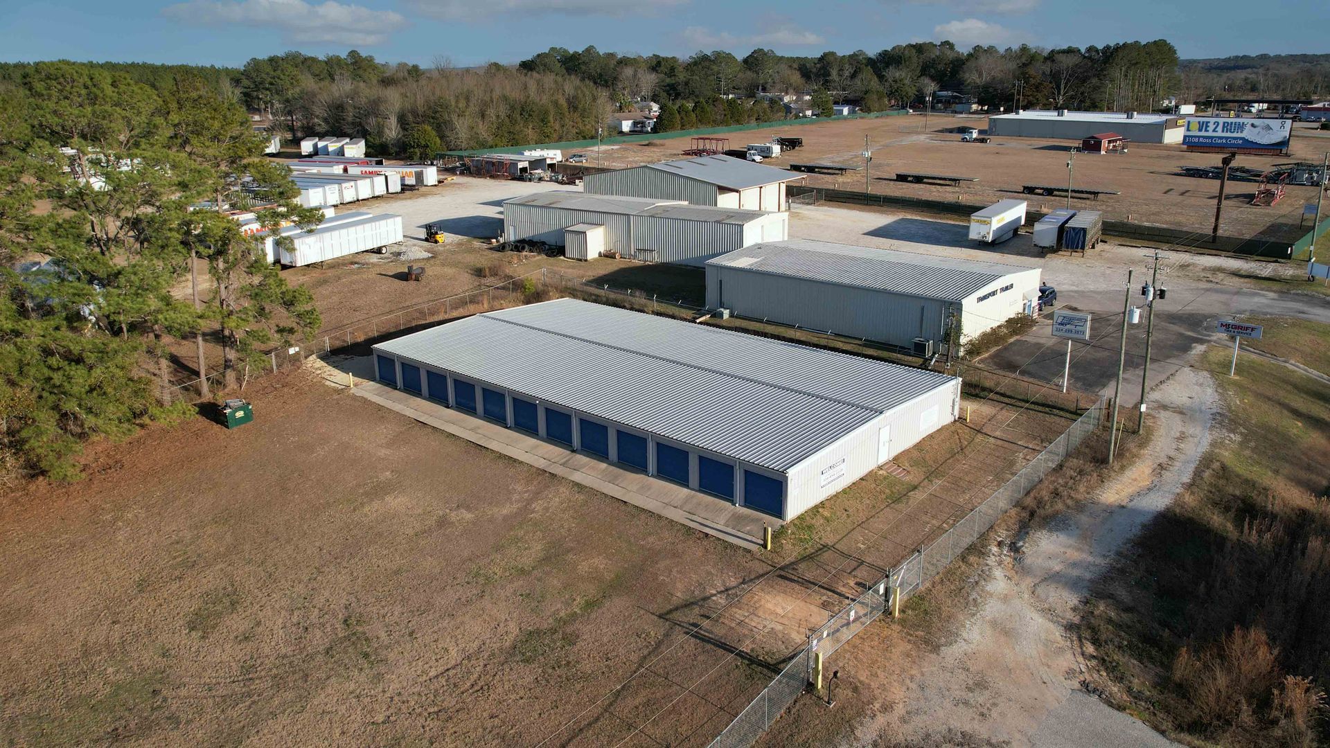 An Aerial View of a fenced storage facility