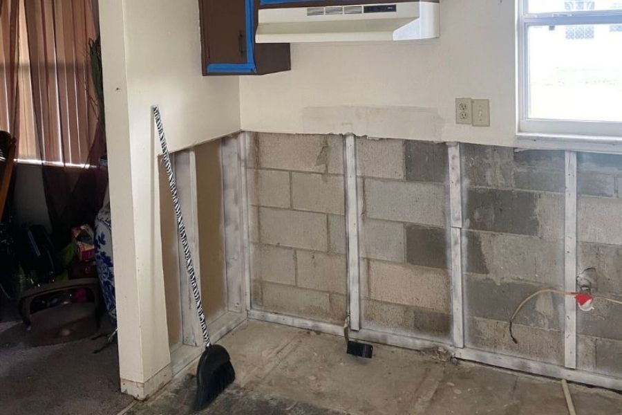 Drywall flood cut showing proper removal technique