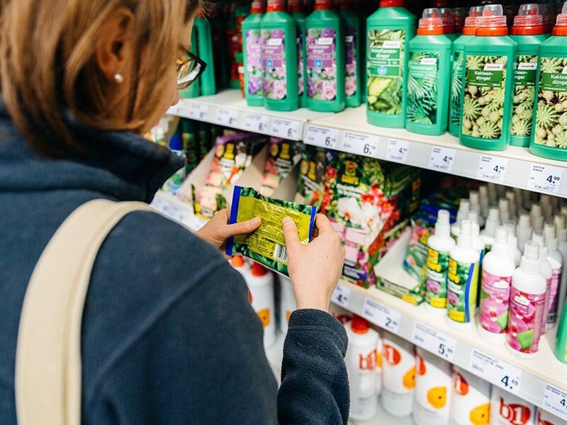 Woman Buying a Garden Chemicals from the Store — Garden Chemicals in Pinelands, NT