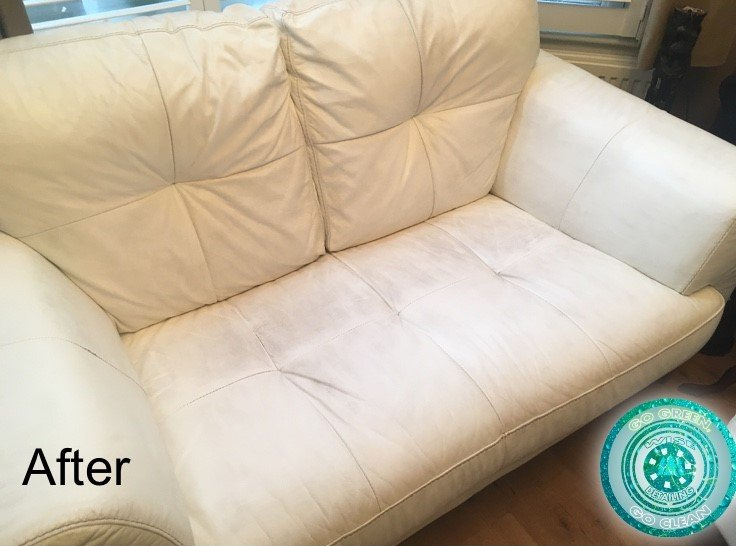 A picture of a white leather couch after being cleaned