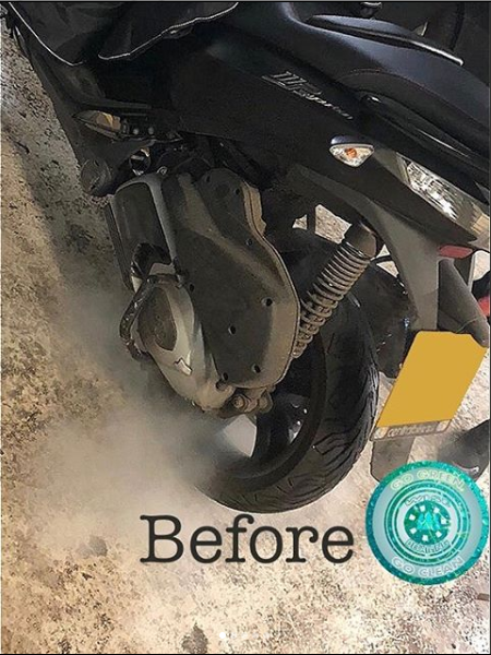 A picture of a motorcycle before being cleaned.