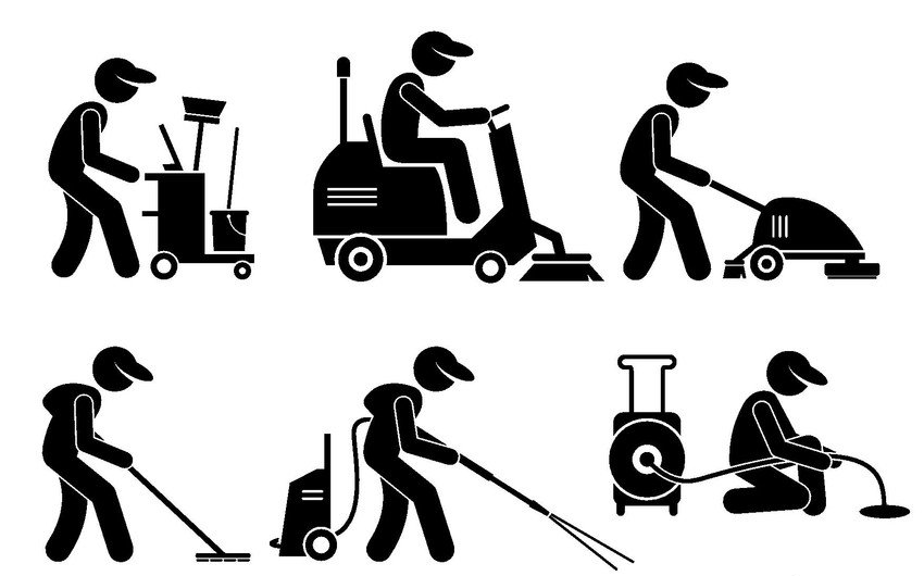 A man is cleaning the floor with a vacuum cleaner.