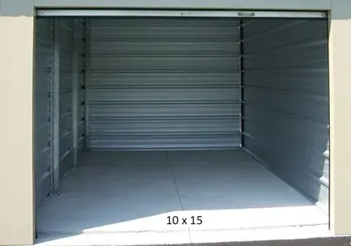 Empty 10x15 storage unit with open roll-up door. Steel walls and floor, neutral colors.