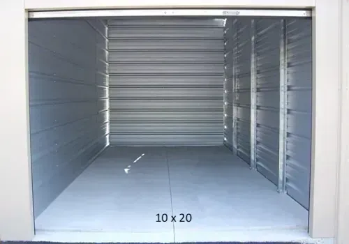 Empty 10x20 storage unit with a roll-up door.