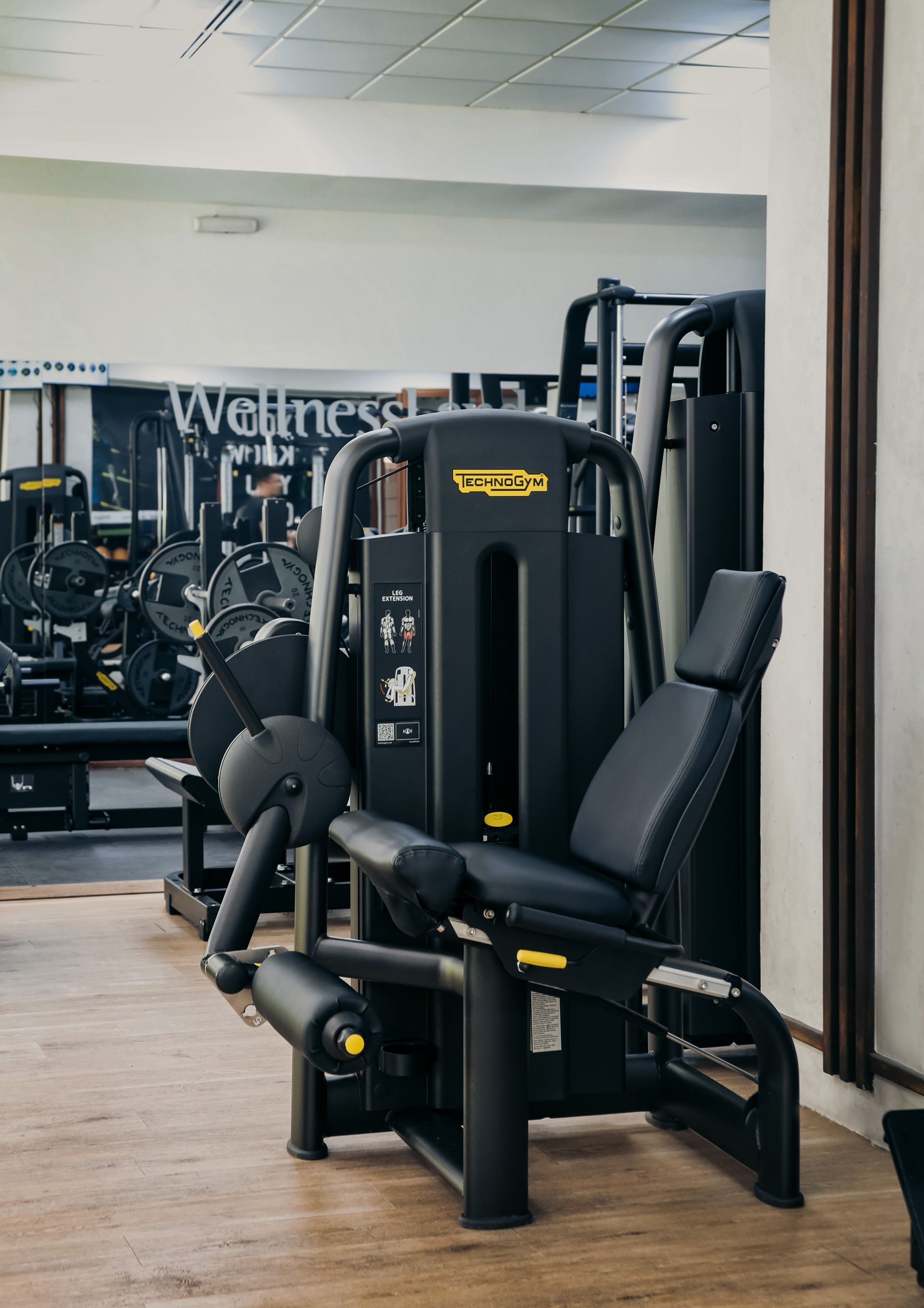 a gym with a sign that says wellness on it