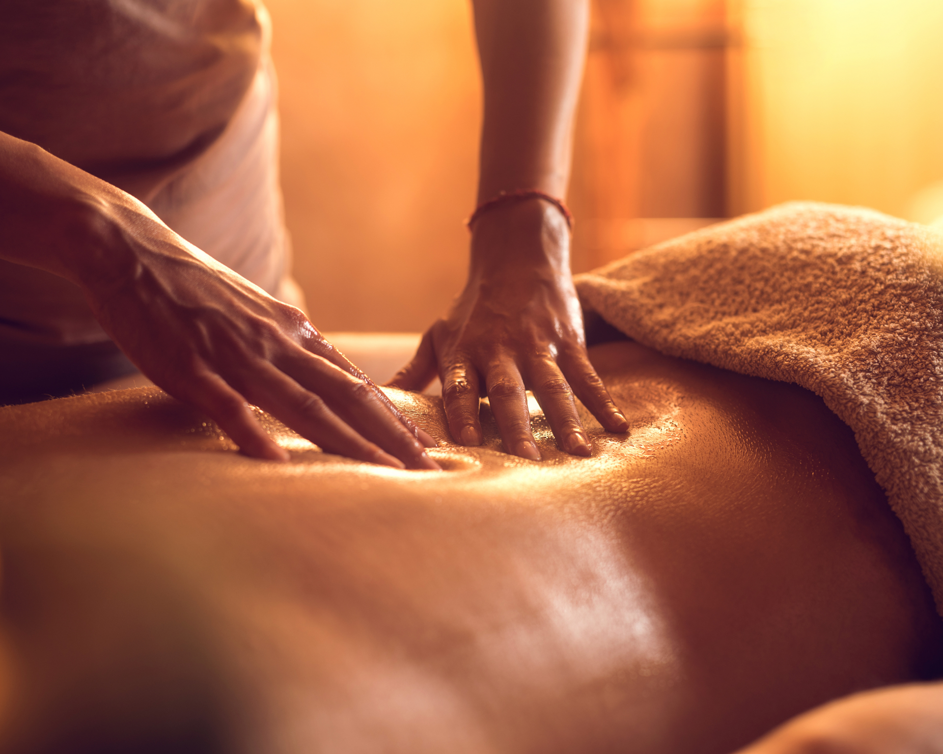 a woman is giving a man a massage in a spa .