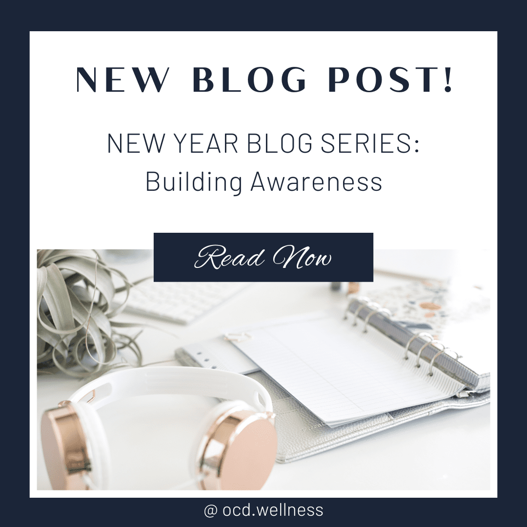 White desk with headphones, notebook, and succulent; New Year blog post promoting building awareness.