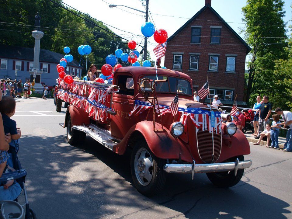 A red truck is decorated for the 4th of july parade