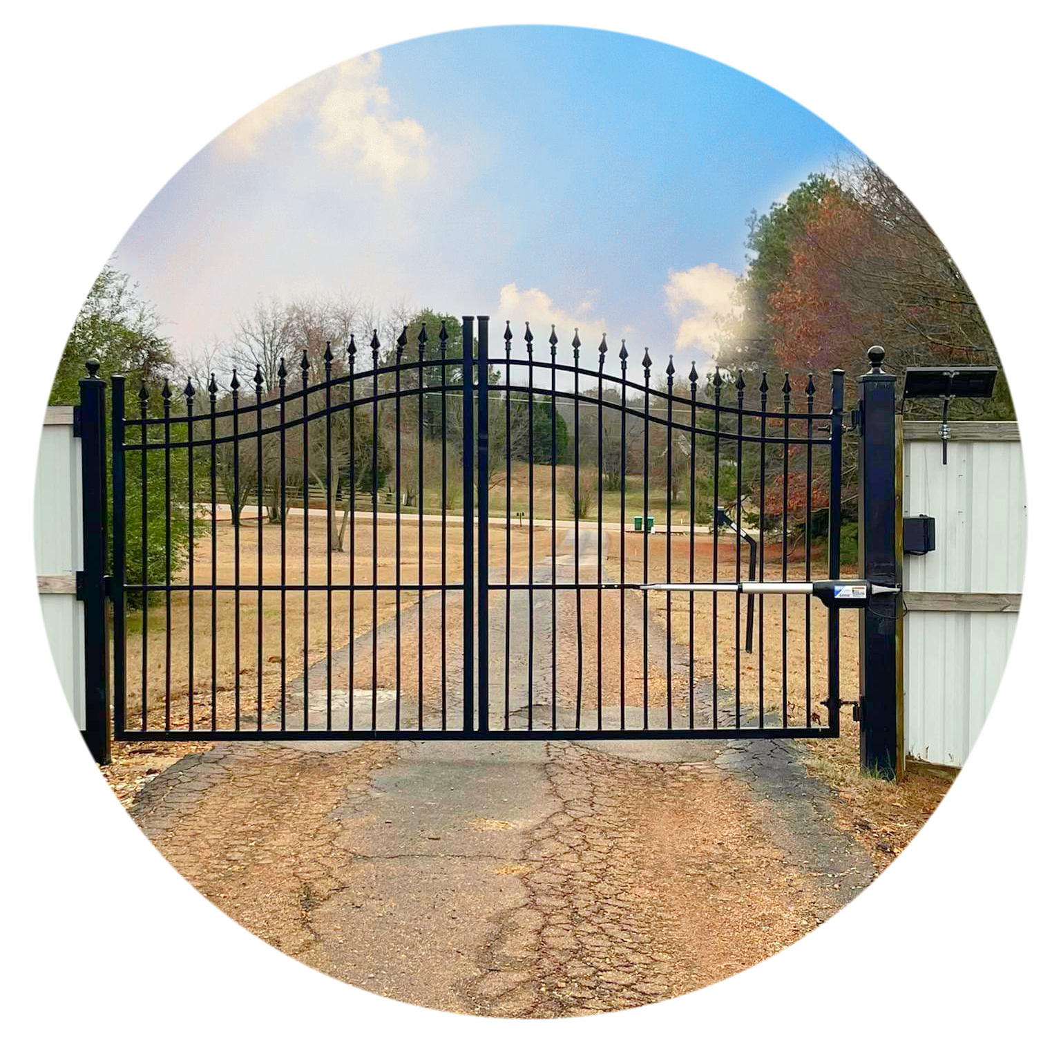road with a closed black automatic gate